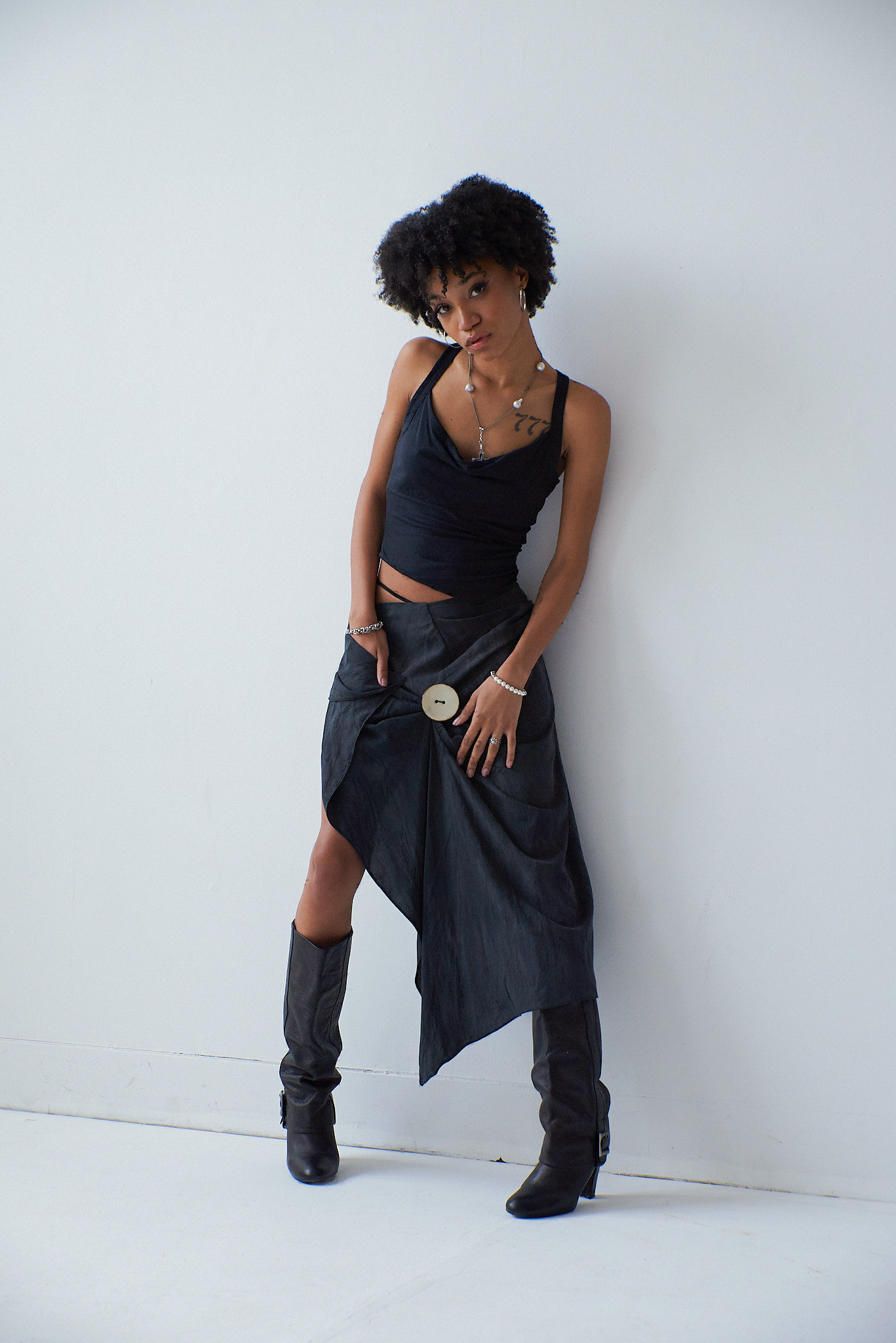 Look One : charcoal tank top and asymmetric skirt. Garments made from recycled materials. Photos by Shanthosh Ravikumar.
